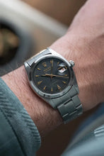 Load image into Gallery viewer, 1959 Rolex - Serviced Roulette Date Honey Comb Black Dial + Gold Markers / Hands
