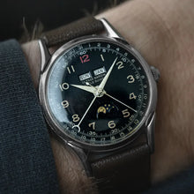 Load image into Gallery viewer, Vintage 1960s Ulysse Nardin Stainless Steel Triple Calendar Moonphase Black Dial
