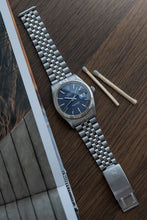 Load image into Gallery viewer, 1973 Rolex 1601 Datejust Stainless Steel &nbsp;Jubilee Blue to Tropical Purplish dial
