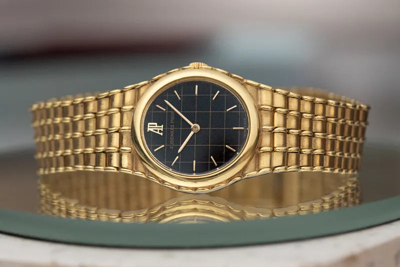 Ladies Audemars Piguet Bamboo 18K Yellow Gold Black Grid Pattern Dial