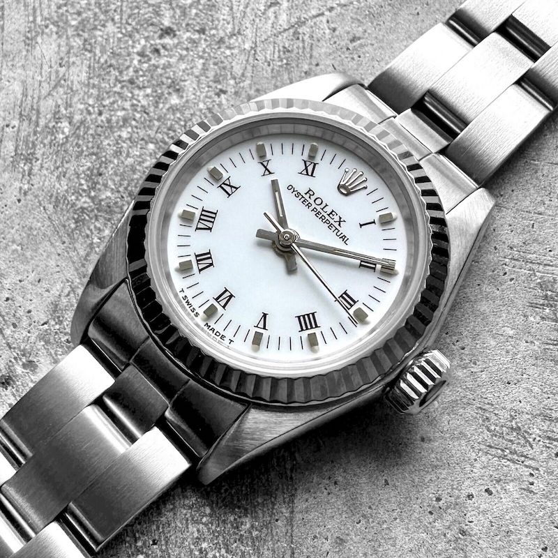 Ladies 26mm Date 67194 Stainless Oyster White dial Roman Numeral Fluted bezel