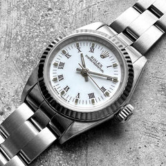 Ladies 26mm Date 67194 Stainless Oyster White dial Roman Numeral Fluted bezel