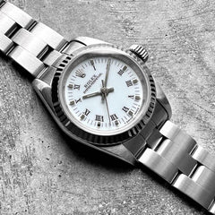 Ladies 26mm Date 67194 Stainless Oyster White dial Roman Numeral Fluted bezel