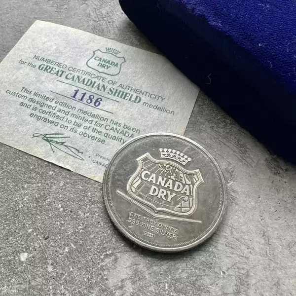 vintage johnson matthey 1oz canada dry silver round.1 result